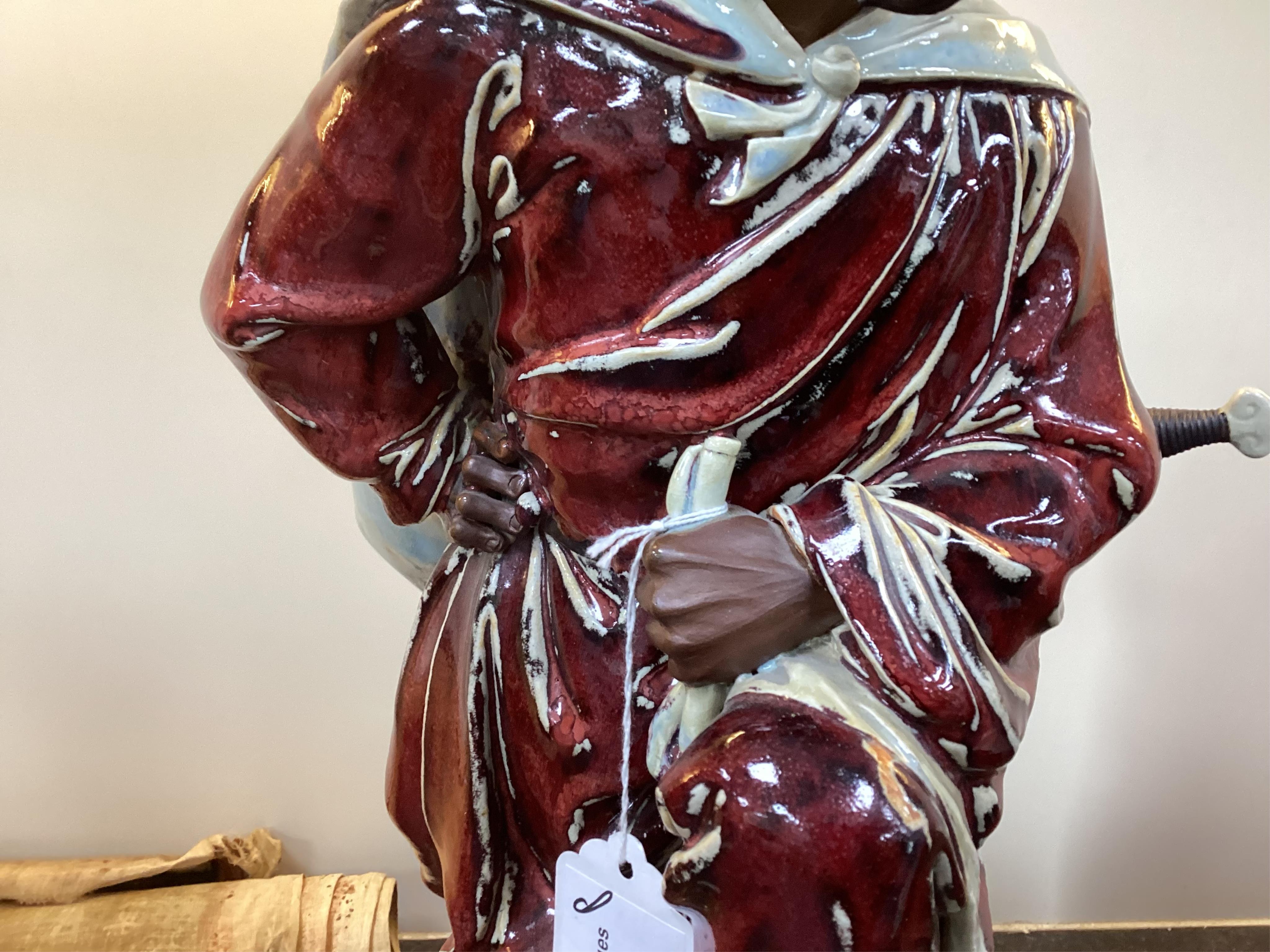 A large Chinese Shiwan stoneware figure of a warrior, 20th century